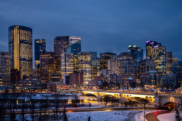 Calgary's skyline  at sunrise on a cold winter day along the Bow River.