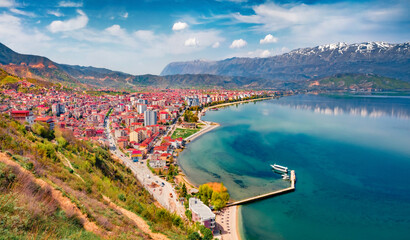 Astonishing spring cityscape of Pogradec town. Impressive outdoor scene of Ohrid lake. Wonderful...