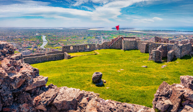 Magnificent spring view of ruins of Lezhe Fortress. Spectacular morning cityscape of Lezha town, Albania, Europe. Traveling concept background.