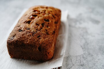 Homemade Christmas fruit cake loaf with copy space, selective focus