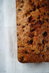 Homemade Christmas fruit cake loaf with copy space, selective focus