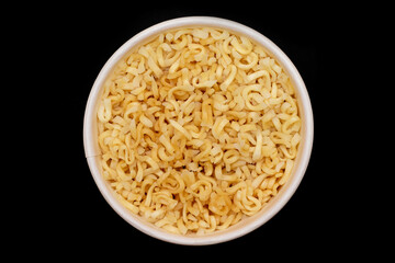 Instant Noodles in Disposable Cup on Black Background - Top View. Asian Fast Food. Quick Lunch