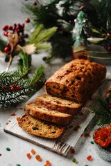 Fototapeta na wymiar Homemade Xmas fruit cake or Indian tutti frutti bread on Christmas holiday background, selective focus