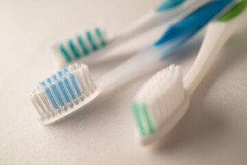 Fototapeta na wymiar Photograph with Shallow Depth of Field of Toothbrushes on a White Background