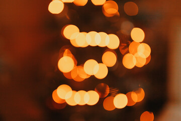 Blurred defocused Christmas tree with festive lights