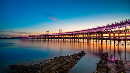 Panoramic view of the ore loading dock of the Rio Tinto mining company in Huelva, Andalusia, Spain. Sunset at the 