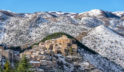 Foto op Plexiglas The beautiful village of Villalago, covered in snow during winter season. Province of L'Aquila, Abruzzo, Italy. © e55evu