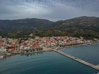 Fototapeta na wymiar Aerial cityscape view of Neapolis town at sunset. Also named Vatika in Laconia, Greece. Neapoli is a famous coastal town built on the same site as the ancient Laconian city of Boeae