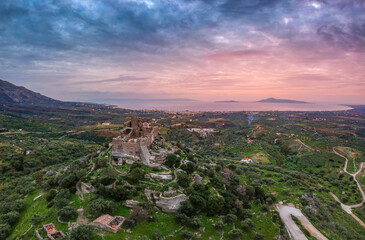 Aerial view of the Castle of Vatika or Castle of Agia Paraskevi at sunset. The castle is located in Mesohori village and has a wonderful view of Neapolis town and Elafonissos island, Laconia, Greece.