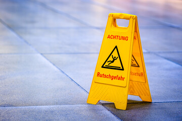 slippery warning sign in germany