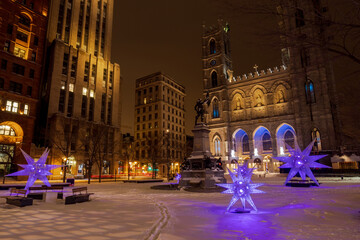 the first snow in Montreal, festive Christmas decoration near Notre-Dame Basilica - obrazy, fototapety, plakaty
