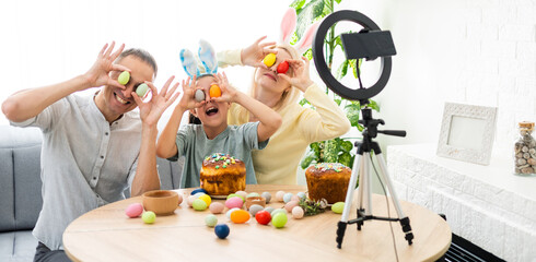 Father, mother and her child enjoy painting Easter eggs. Shop Online for happy easter decoration. Easter eggs - color egg assortment