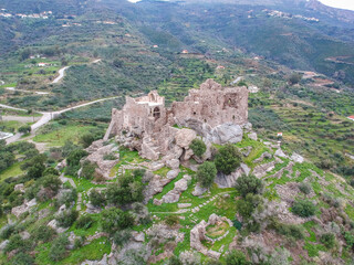 Fototapeta na wymiar Aerial view of the Castle of Vatika or Castle of Agia Paraskevi at sunset. The castle is located in Mesohori village and has a wonderful view of Neapolis town and Elafonissos island, Laconia, Greece.