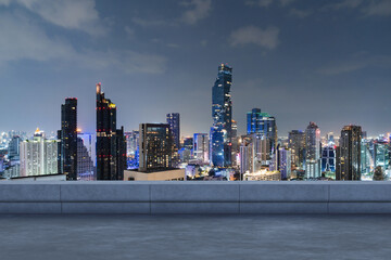 Panoramic Bangkok skyline view, concrete observatory deck on rooftop, night time. Asian corporate...