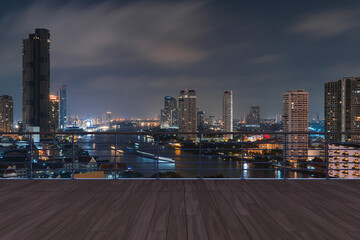 Panoramic Bangkok skyline view, wooden observatory deck on rooftop, night time. Asian corporate and residential lifestyle. Financial city downtown, real estate. Product display mockup empty roof