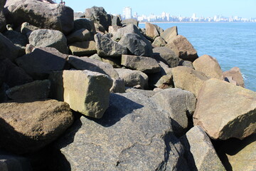 city, rocks and ocean