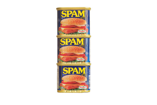 MONTREAL, QUEBEC,  CANADA - June 25th, 2018: three stacked tin cans of Spam luncheon ham meat. Studio shot on white