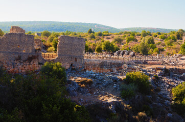 Fototapeta na wymiar Kizkalesi,Turkey-October 11,2021:Panoramic landscape view ruins of antique city. Kanlidivane ancient city in Mersin Province, Turkey. Open air museum.