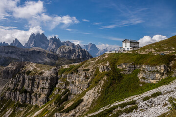 Fototapeta na wymiar clouds over mountain trail Tre Cime di Lavaredo in Dolomites in Italy