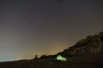 Fototapeta na wymiar Usar Major or Big Dipper over tent at rocky landscape in Croatia