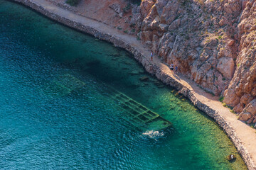 Wreck of the sunken German World War 2 ship of the Zavratnica cove with clear blue water near the...
