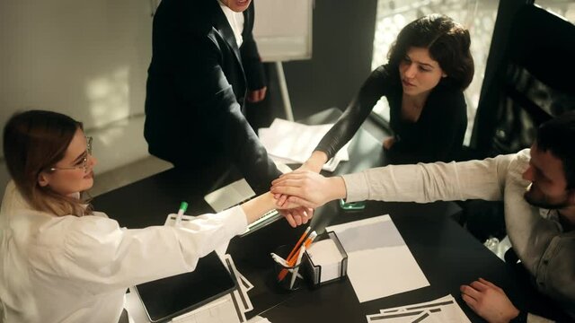Close up group of people stack hands put palms together. Team spirit. Teamwork stacking hand concept. High quality 4k footage