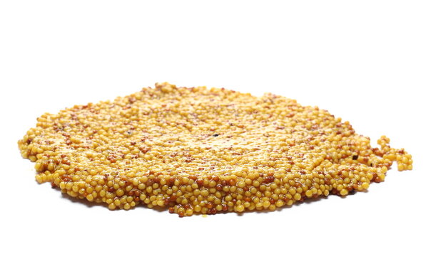 Pile mustard of whole grains, spreading isolated on white 