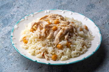 Traditional delicious Turkish food; Rice with chickpeas and chicken (Turkish name; Tavuklu nohutlu pilav or pilaf)