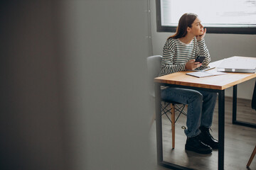 Young woman studing at the office