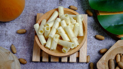 Christmas cake, wafer roll stick on wooden bowl, Food Phtotography, Food and beverage concept.