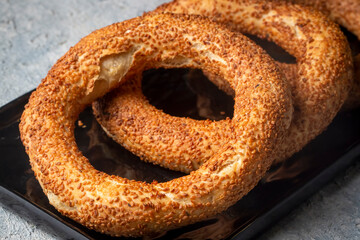 Turkish fast food bagel called Simit. Turkish bagel Simit with sesame. Bagel is traditional Turkish bakery food. Turkish name; simit - gevrek