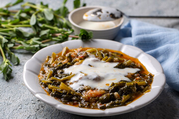 Traditional Turkish cuisine purslane dish with yoghurt (Turkish name; Yogurtlu semizotu yemegi)