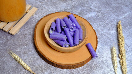Christmas cake, wafer roll stick on wooden bowl, Food Phtotography, Food and beverage concept.