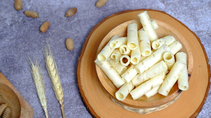 Christmas cake, wafer roll stick on wooden bowl, Food Phtotography, Food and beverage concept.
