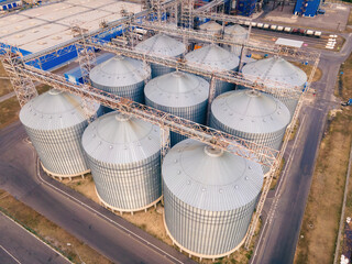 Grain storage in large silos aerial view. Silo with grain. Grain storage tank view from above