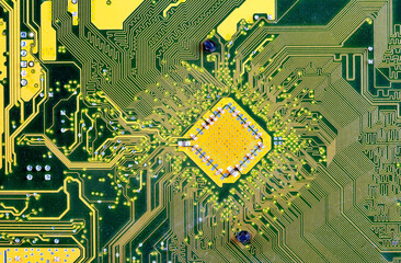 Yellow green computer circuit board PCB motherboard abstract background texture, backdrop, object structure detail, extreme closeup, nobody. Technology, PC hardware electrical components backgrounds