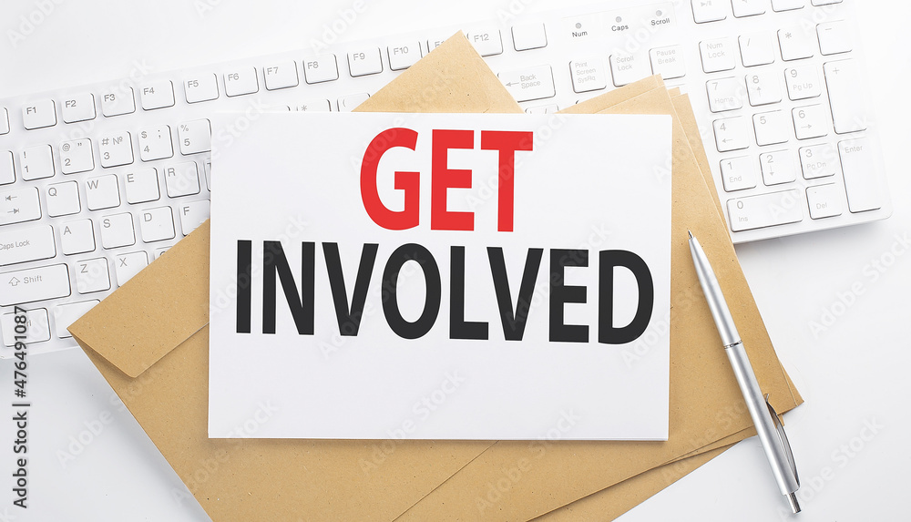 Poster text get involved on the envelope on the keyboard