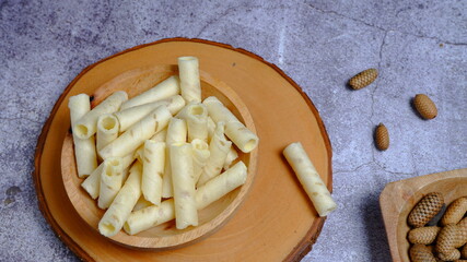 Christmas cake, wafer roll stick on wooden bowl, Food Phtotography, Food and beverage concept.