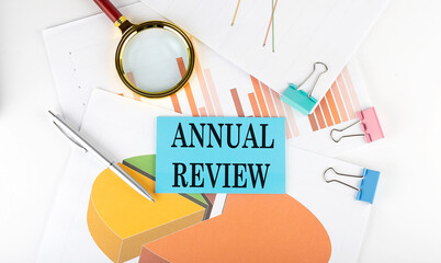 ANNUAL REVIEW text on the sticker on the paper diagram