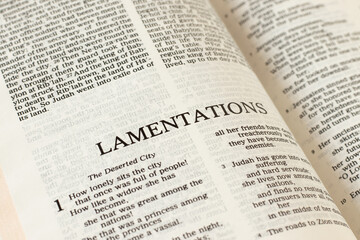 Lamentations open Bible Book. A close-up. Studying Old Testament Holy Scriptures Jeremiah prophet. Christian biblical concept of grief, sin, forgiveness by God Jesus Christ.