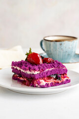 Forest fruit cake on a white background. Turkish sweet dessert concept. plate of sliced forest fruit cake. Mediterranean bakery. close up. selective focus. Vertical view. Story format.