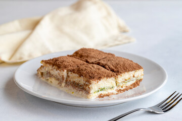 Cold baklava on a dark background. Turkish sweet dessert concept. plate of sliced forest fruit...