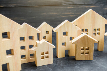 City of wooden figurines of houses. Buying and selling real estate. Renovation and home...