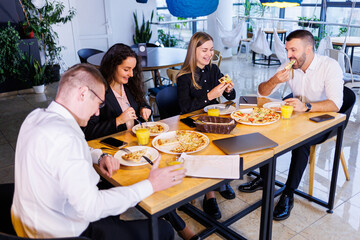 Young designers discuss new project ideas with their partners in the conference room at lunch. Business people are discussing a new business project in the office.