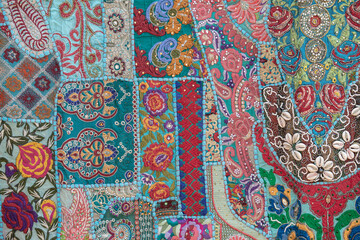 Detail old colorful patchwork carpet in India. Close up