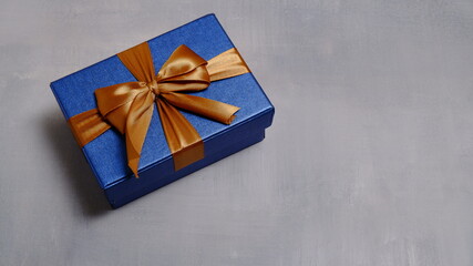 Cute gift box with satin ribbon on the table. Christmas and new year concept, Valentine Concept. Copy space, Negative Space. High View.