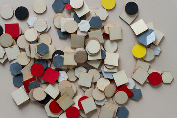 grungy wooden tiles (some painted) scattered on a paper surface