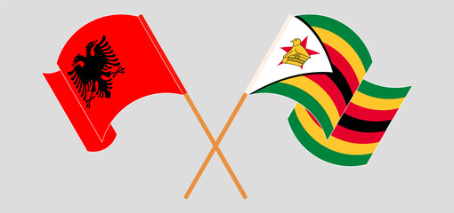 Crossed flags of Albania and Zimbabwe. Official colors. Correct proportion