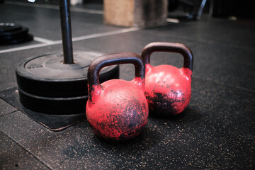 Obraz na płótnie Canvas Two fitness gym kettlebells on ground