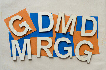 letters G, D, M, and R on paper squares